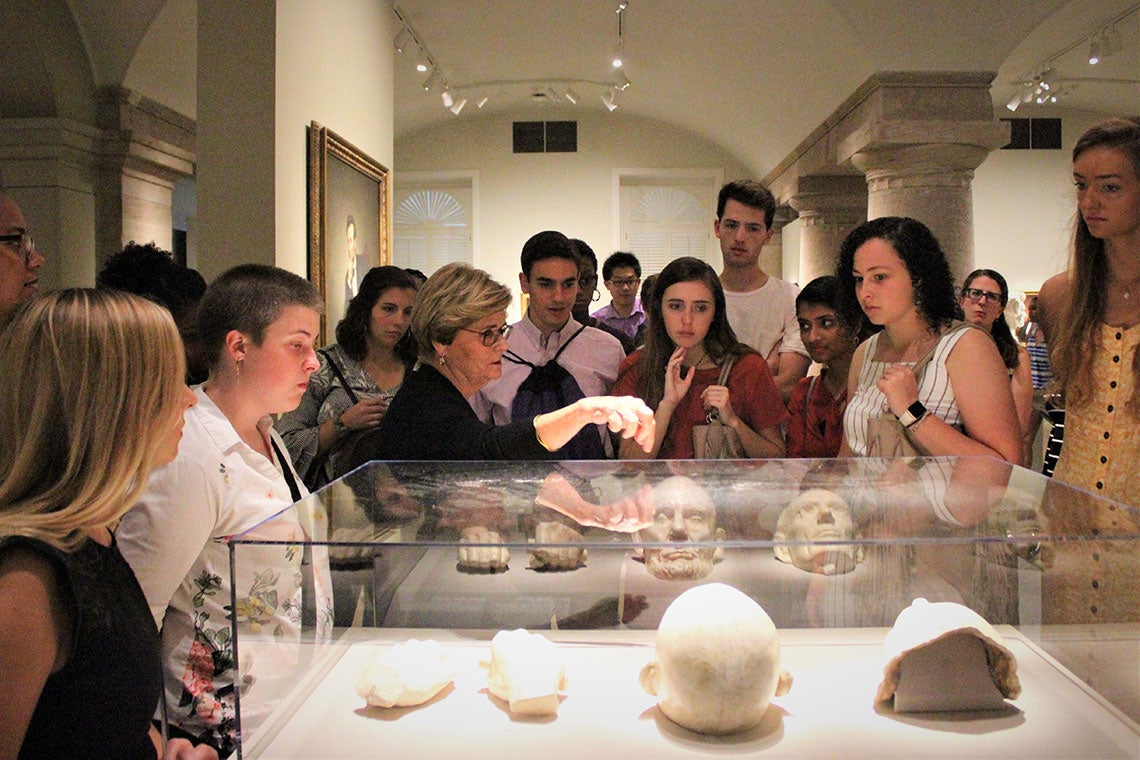 Students look over Lincoln artifacts