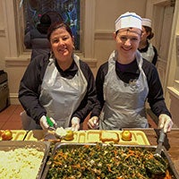 Students volunteering in a kitchen